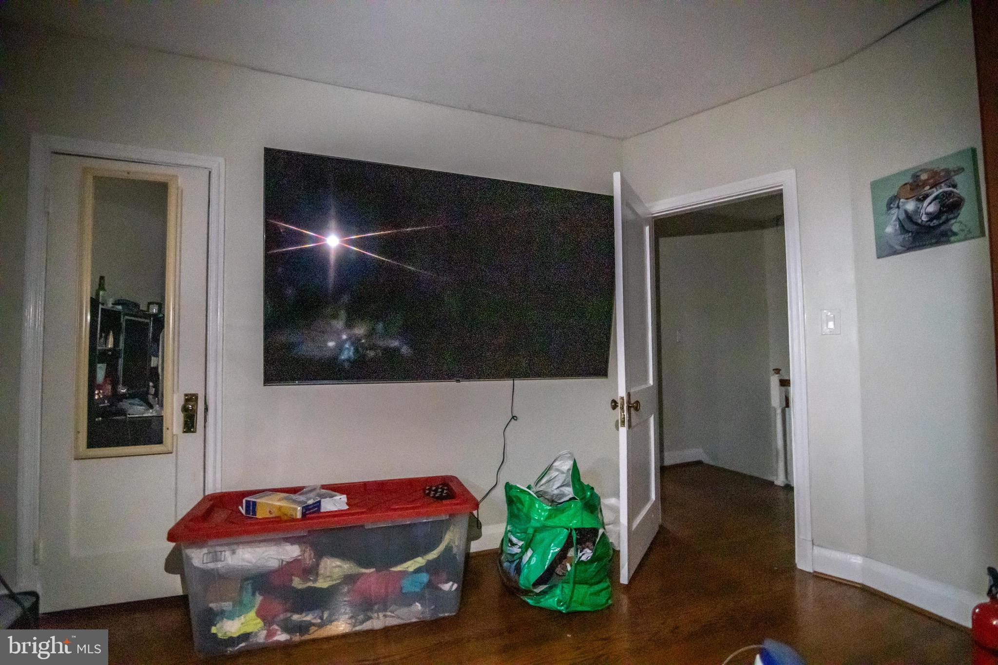 1649 Ralworth Road Baltimore, MD 21218 - Photo 8 of 47 a living room with furniture and potted plant