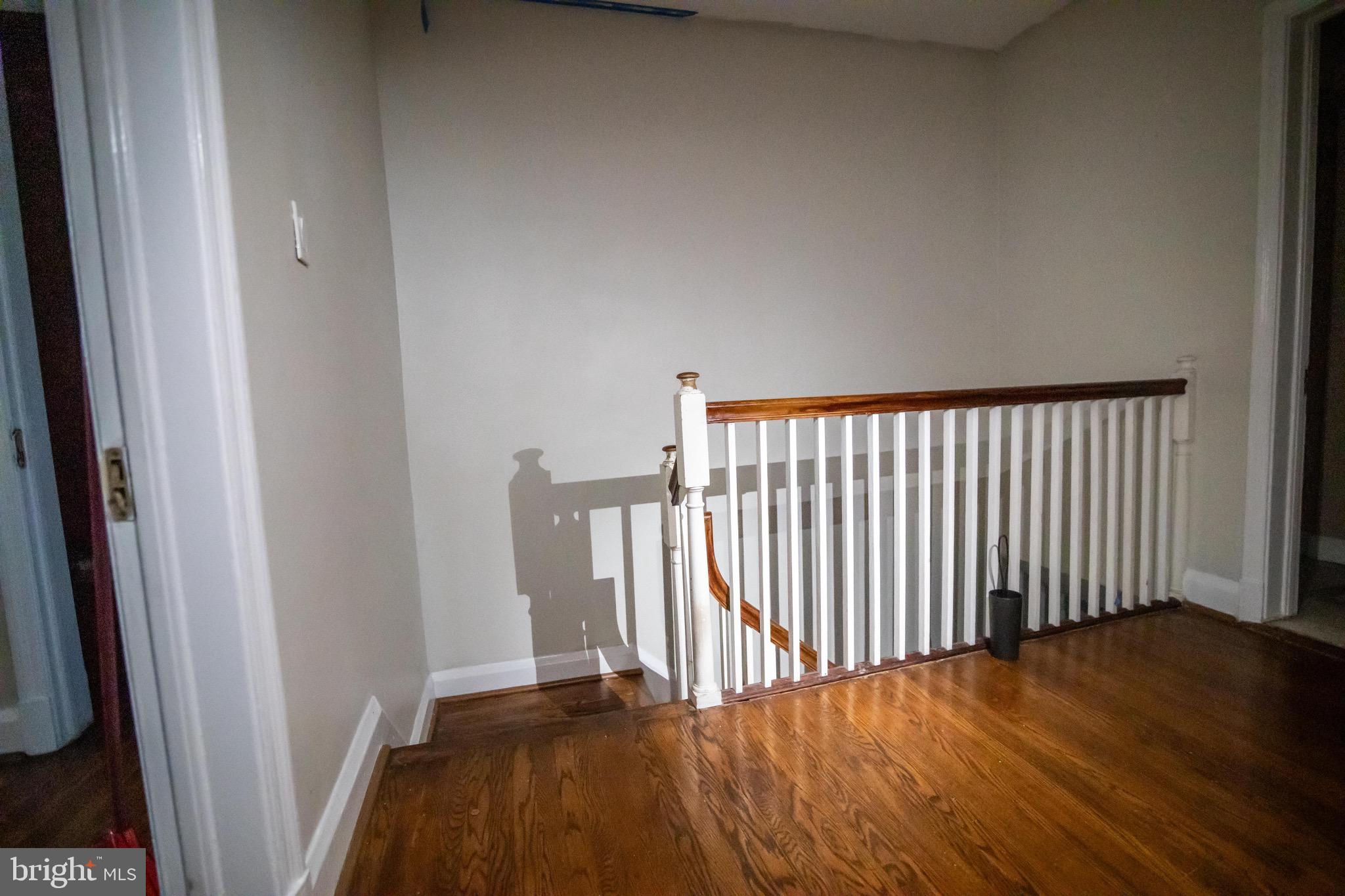 1649 Ralworth Road Baltimore, MD 21218 - Photo 10 of 47 a view of a hallway with wooden floor
