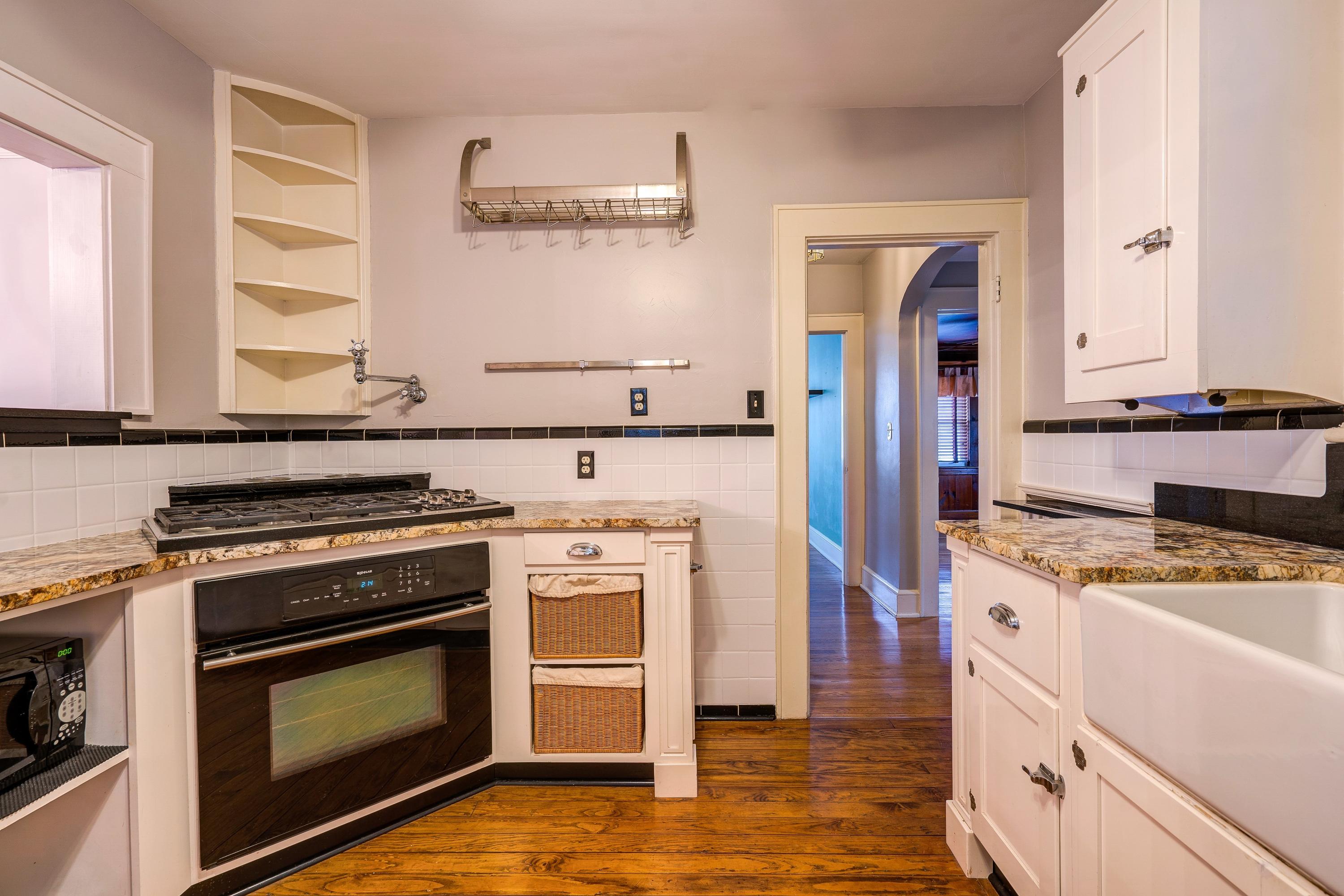 a kitchen with a stove and a refrigerator