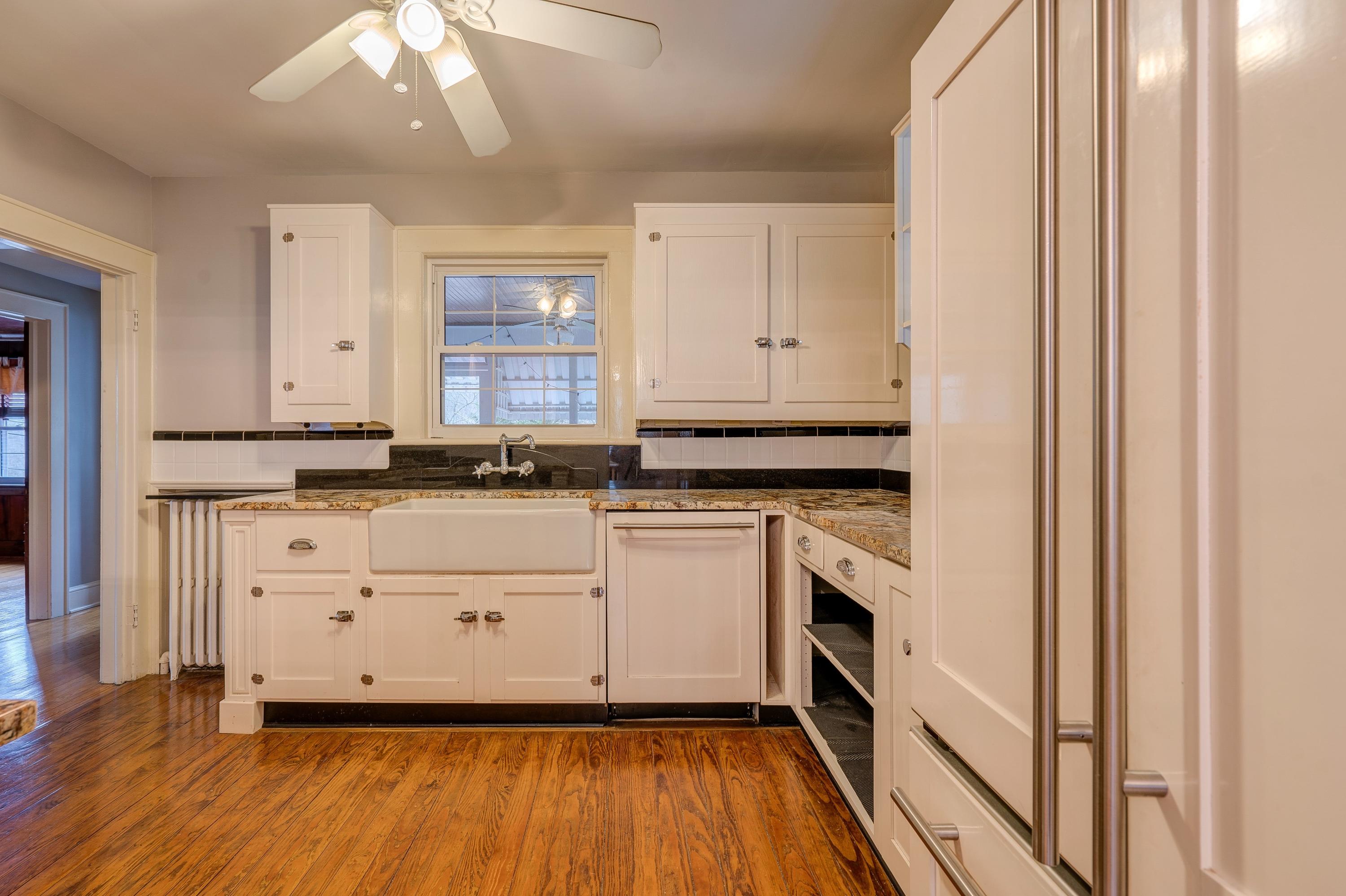 1502 Terrace Road Southwest Roanoke, VA 24015 - Photo 12 of 35 a white stove top oven sitting inside of a kitchen