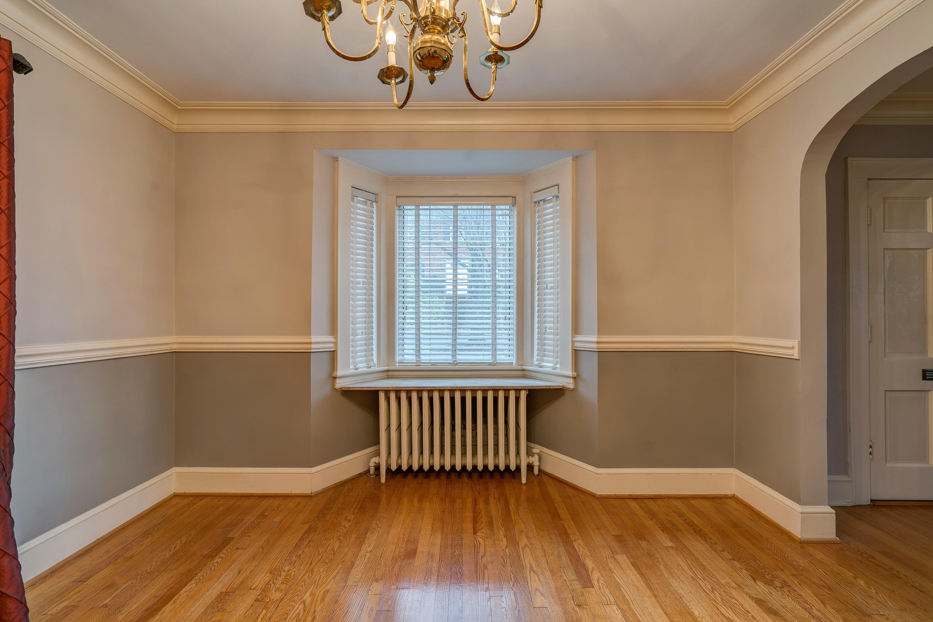 1502 Terrace Road Southwest Roanoke, VA 24015 - Photo 15 of 35 a view of an empty room with a window and wooden floor