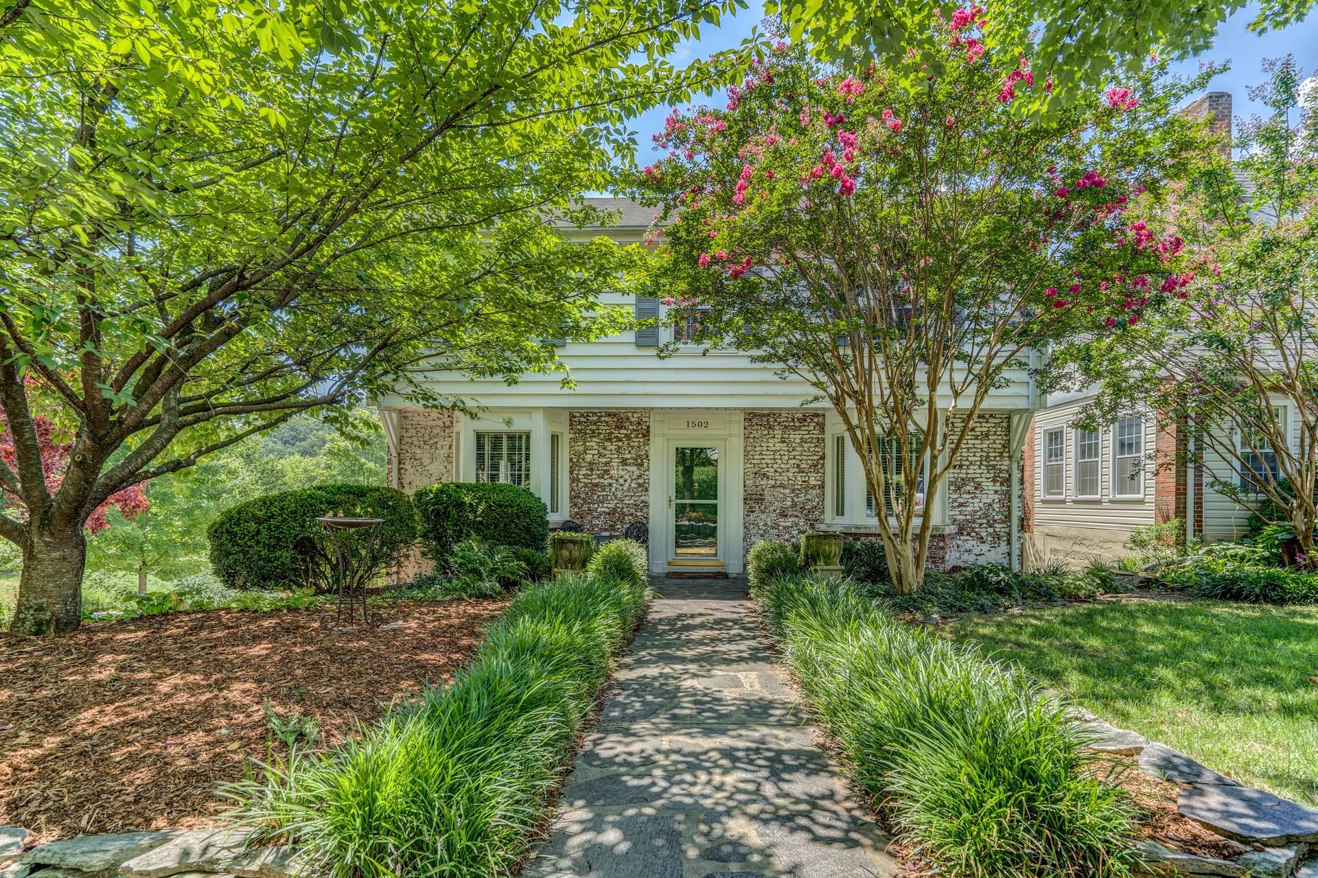 1502 Terrace Road Southwest Roanoke, VA 24015 - Photo 2 of 35 a front view of a house with garden