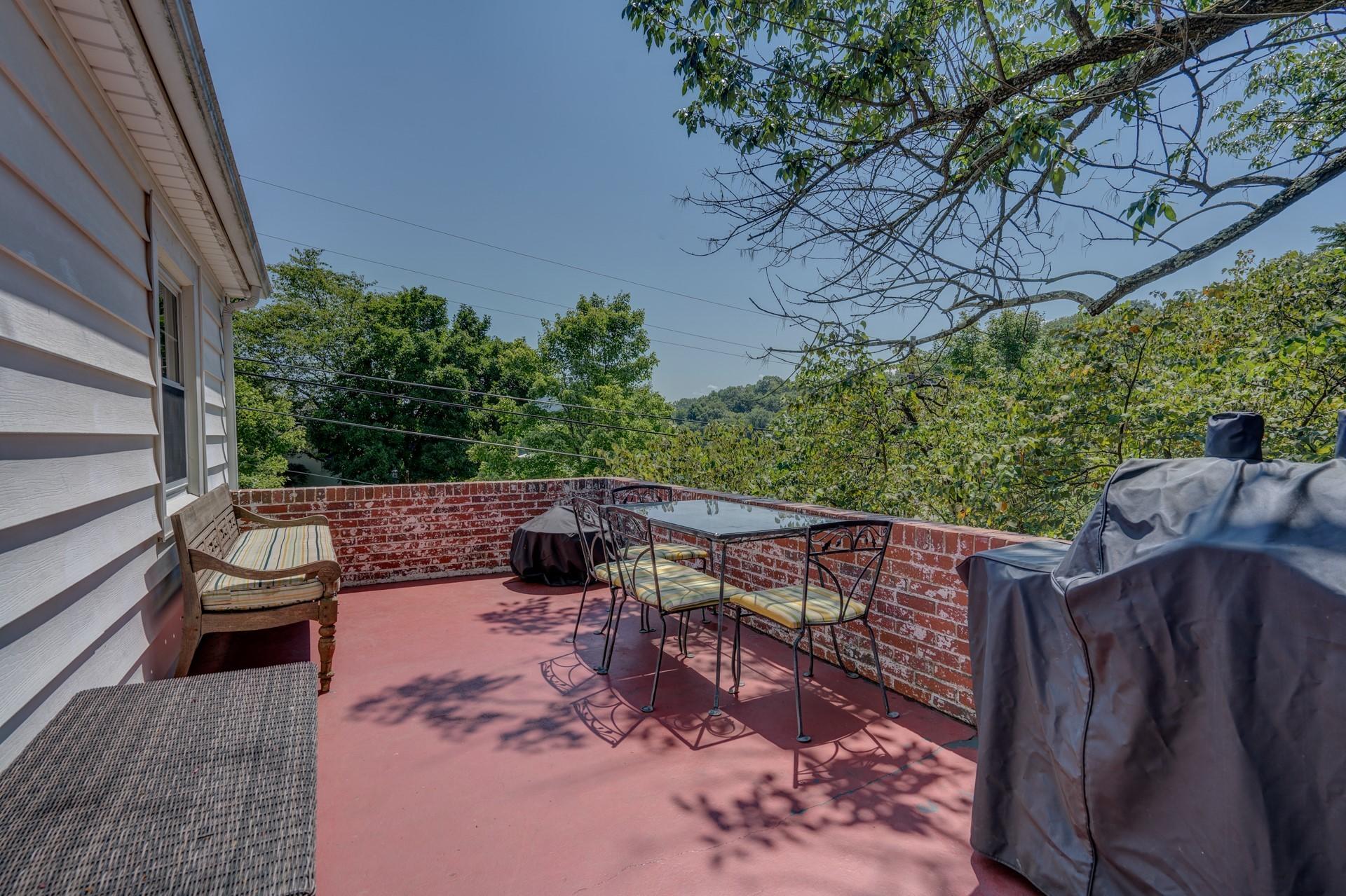 1502 Terrace Road Southwest Roanoke, VA 24015 - Photo 21 of 35 a view of backyard with deck and outdoor seating