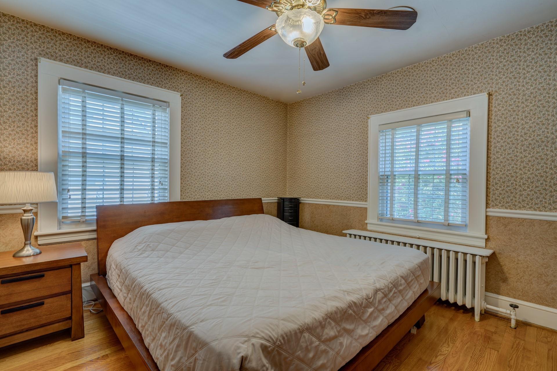 1502 Terrace Road Southwest Roanoke, VA 24015 - Photo 25 of 35 a bed sitting in a bedroom next to a window