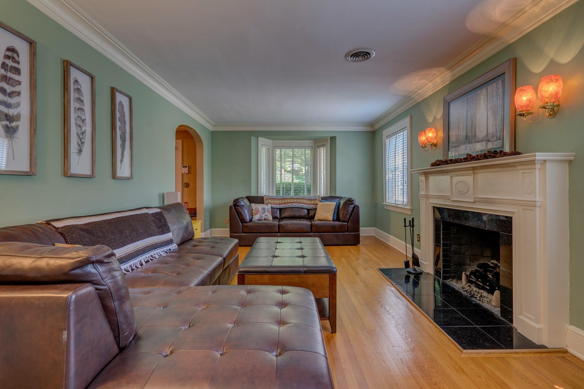 1502 Terrace Road Southwest Roanoke, VA 24015 - Photo 8 of 35 a living room with furniture and a fireplace