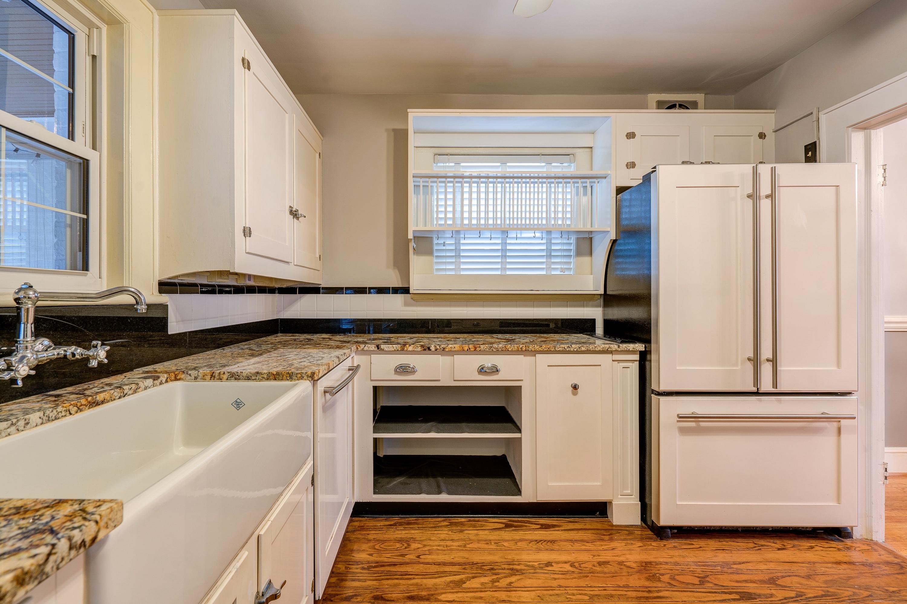 1502 Terrace Road Southwest Roanoke, VA 24015 - Photo 10 of 35 a kitchen with a stove a sink and a refrigerator