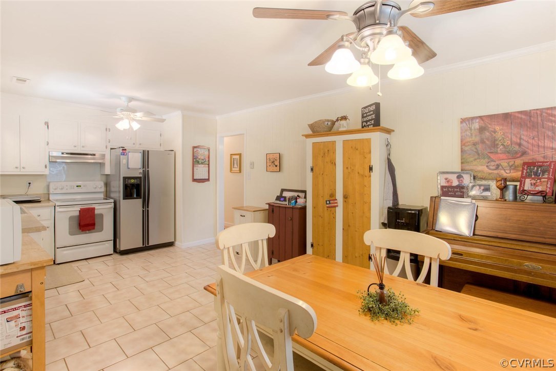11841 River Road Chesterfield, VA 23838 - Photo 24 of 32 a living room with stainless steel appliances kitchen island granite countertop furniture and a chandelier