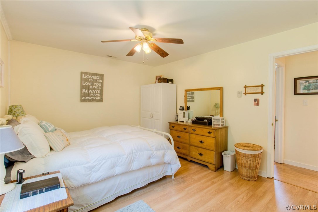 11841 River Road Chesterfield, VA 23838 - Photo 28 of 32 a bedroom with a bed and wooden floor