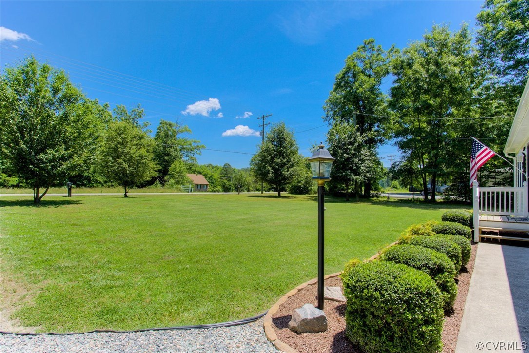 11841 River Road Chesterfield, VA 23838 - Photo 5 of 32 a view of a garden with a tree in a park