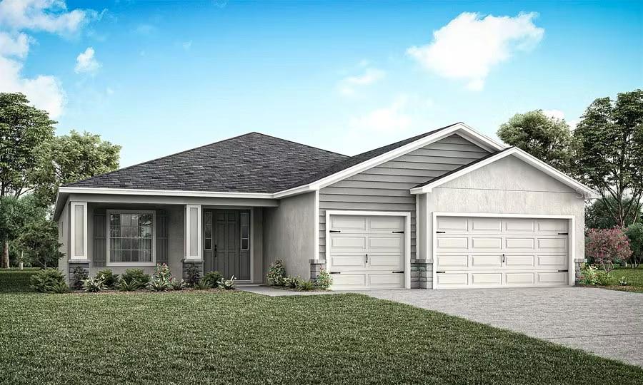 1826 Teleford Road St. Cloud, FL 34771 - Photo 1 of 4 a front view of a house with a garden