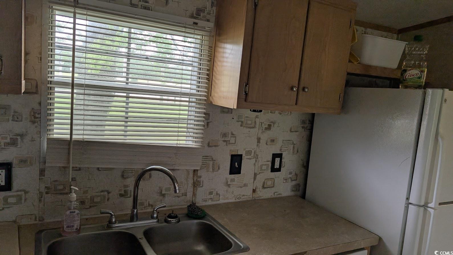 4470 Bethel Road Aynor, SC 29511 - Photo 7 of 22 Kitchen featuring a sink, light countertops, frees