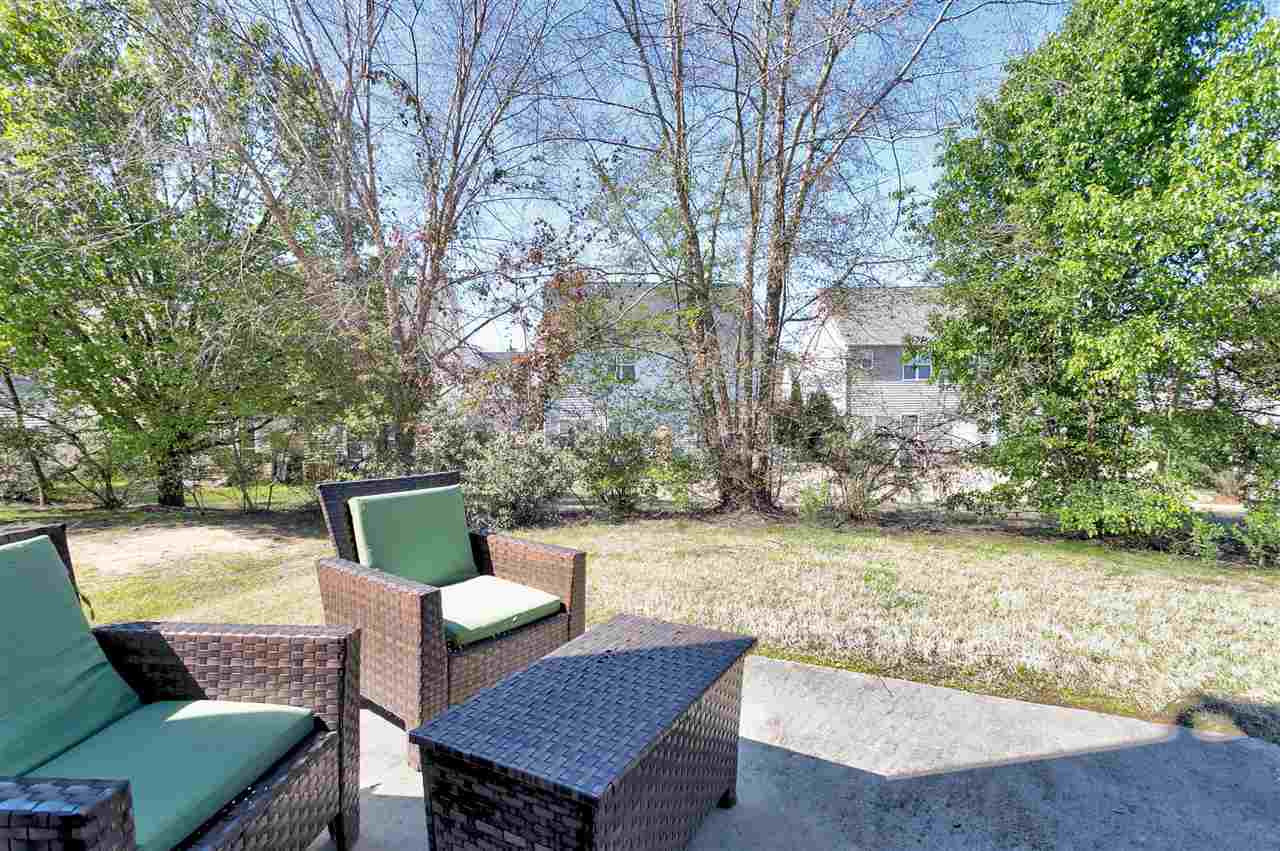 2049 Persimmon Ridge Drive Raleigh, NC 27604 - Photo 12 of 15 Unlike some town homes, this home offers outdoor space, providing room for your pet to play, or just bringing a bit of nature to your outdoor time. Once the trees fill in with leaves, you will enjoy complete privacy and solitude! Back Yard