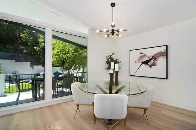 a kitchen with white cabinets and appliances