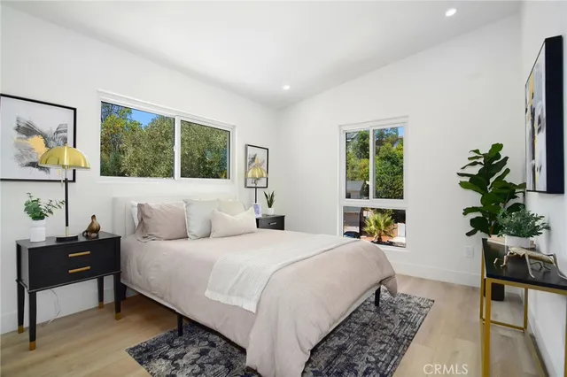a view of a patio with table and chairs and potted plants
