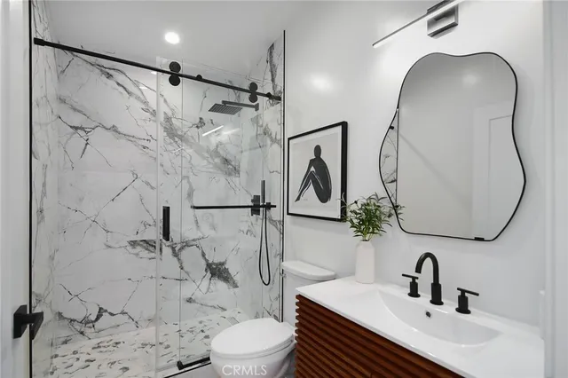 a living room with furniture a flat screen tv and a large window