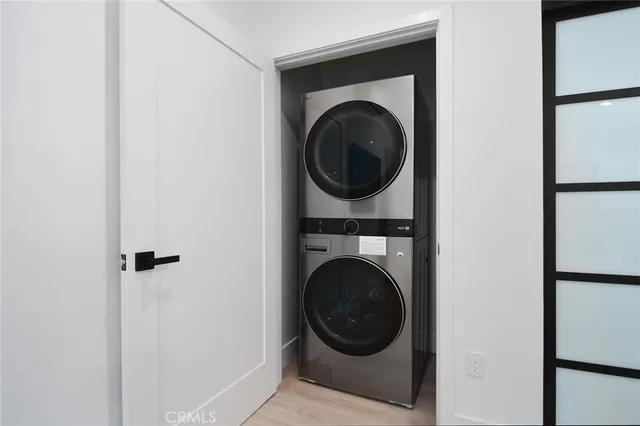 a bedroom with a bed and a potted plant