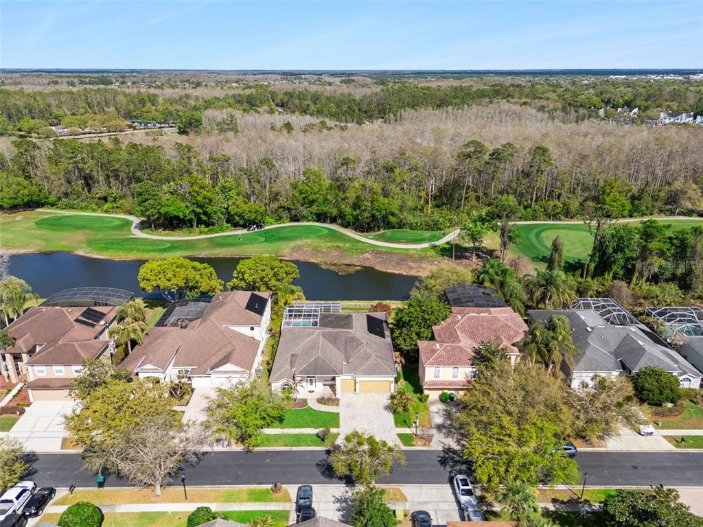 2541 Teton Stone Run Orlando, FL 32828 - Photo 65 of 82 an aerial view of a city with lots of residential buildings and mountain view in back