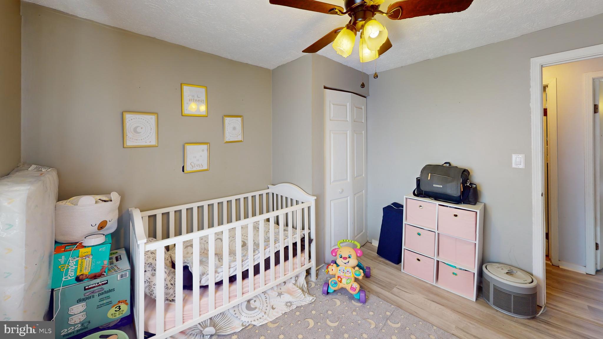 37 Decatur Lane Sicklerville, NJ 08081 - Photo 20 of 26 a bedroom with a baby crib lounge chair and a window