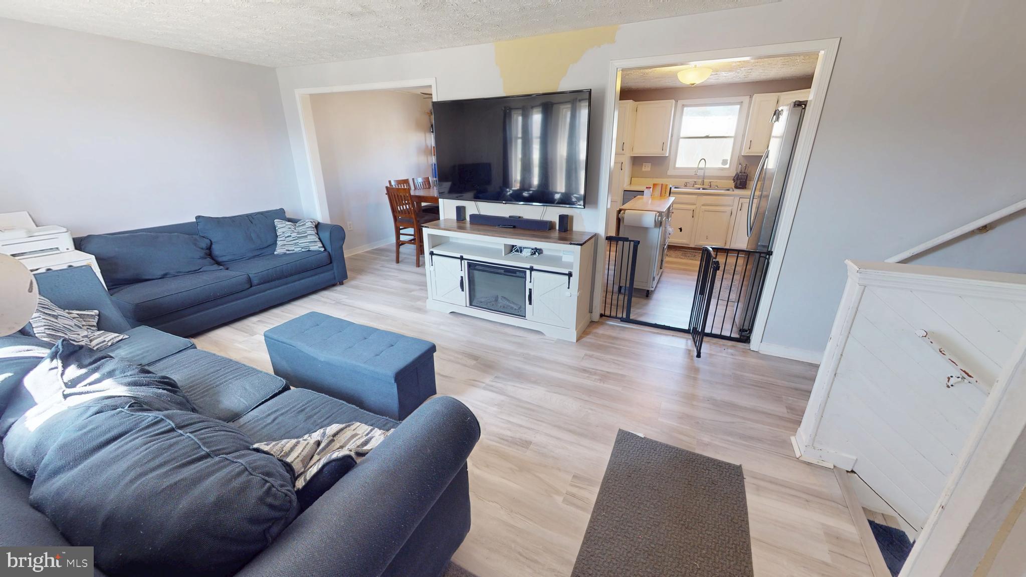 37 Decatur Lane Sicklerville, NJ 08081 - Photo 4 of 26 a living room with furniture and a fireplace