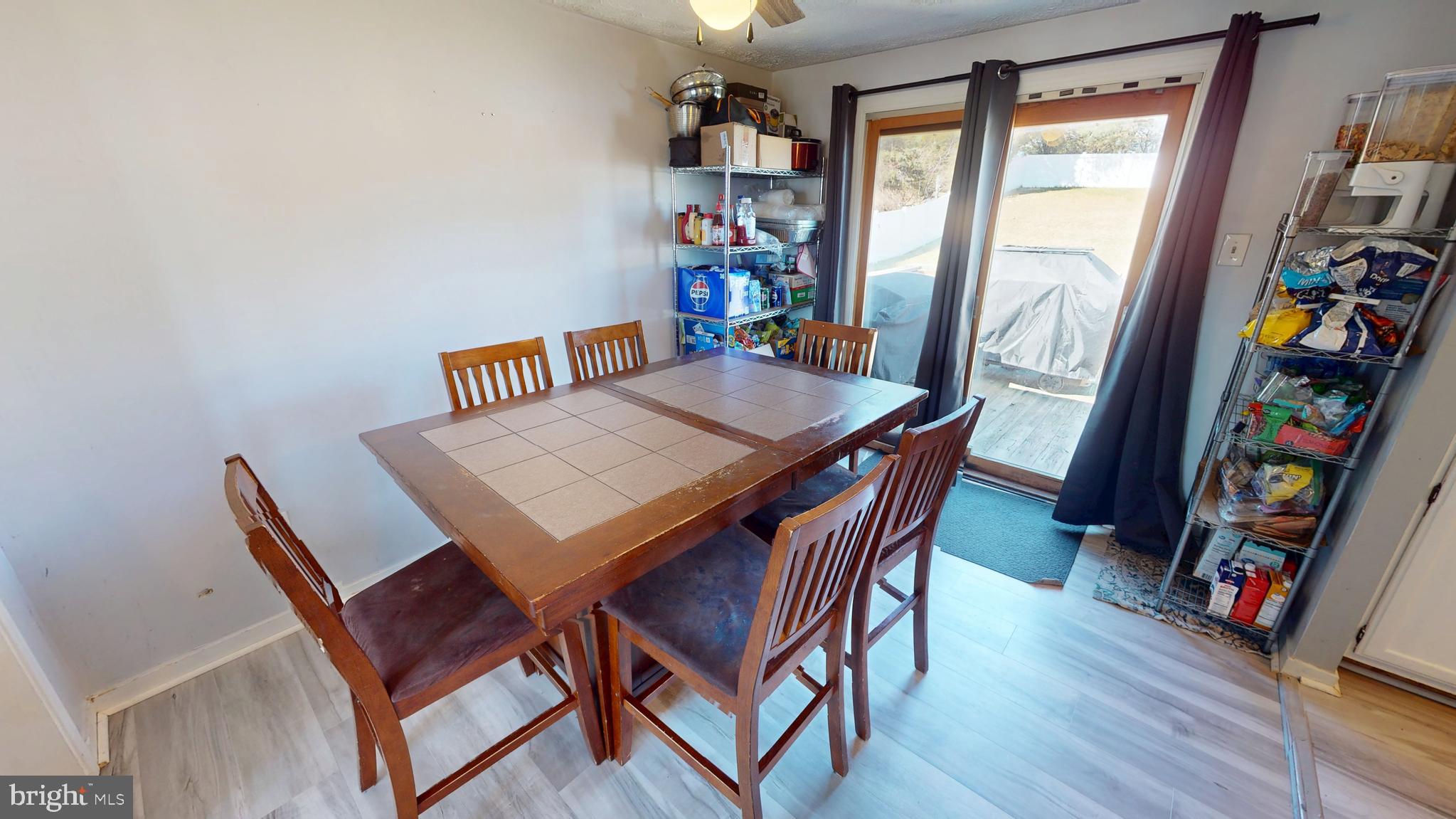 37 Decatur Lane Sicklerville, NJ 08081 - Photo 7 of 26 a view of a dining room with furniture and a book shelf