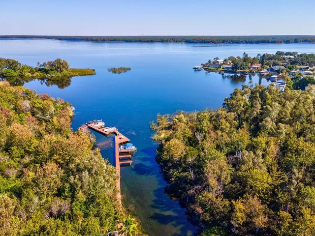 a view of a balcony with a yard