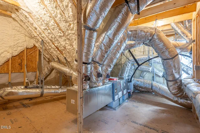 a view of a city from a balcony with furniture
