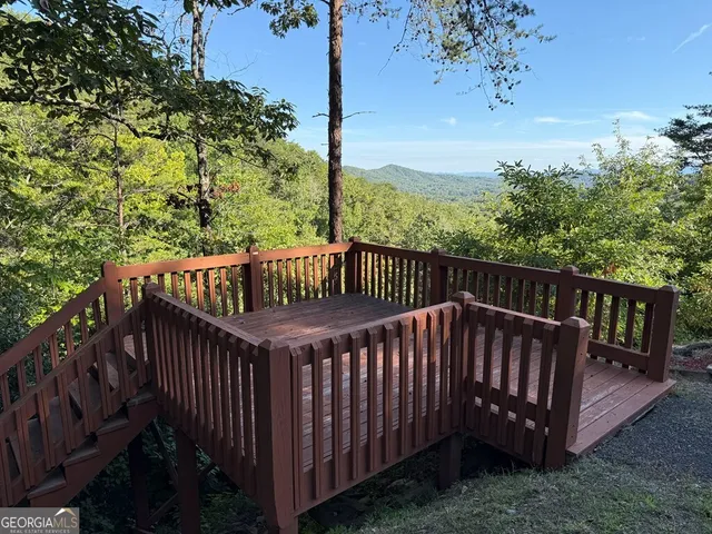 a view of a roof deck with wooden fence