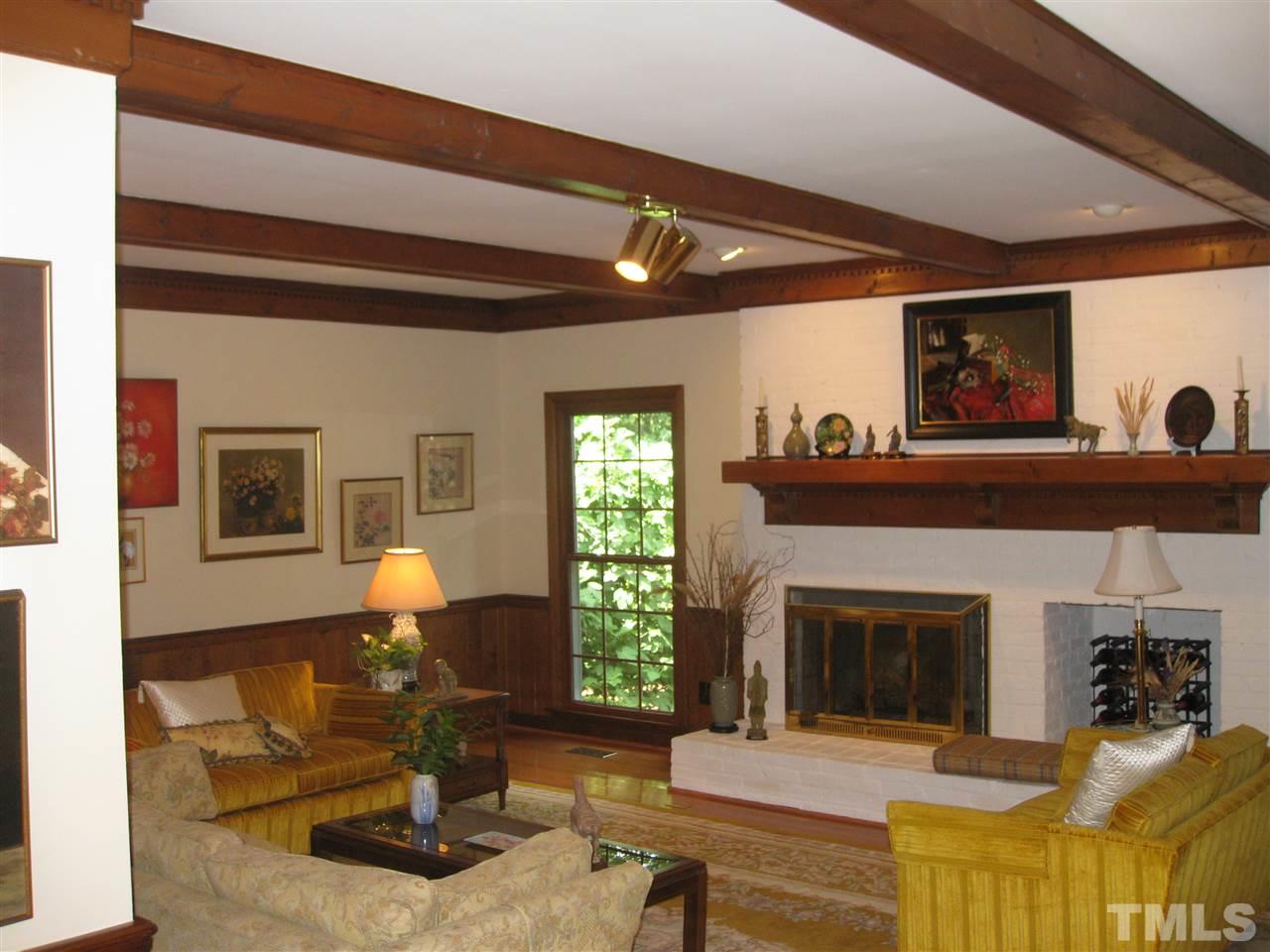 7904 Sutterton Court Raleigh, NC 27615 - Photo 3 of 22 Beautiful fireplace. see build in bookcases