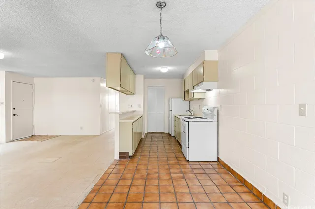 a kitchen with a sink cabinets and window