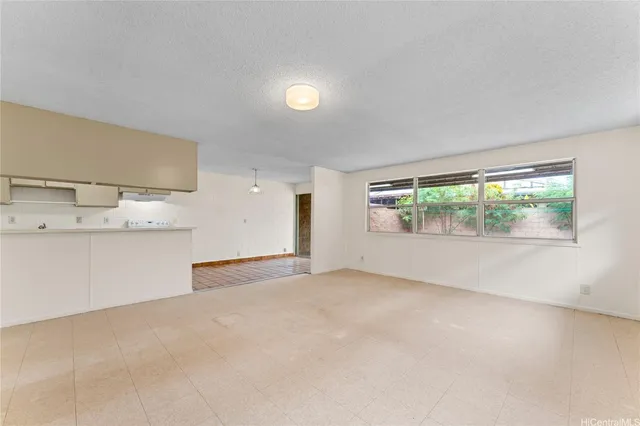 an empty room with a empty space and window