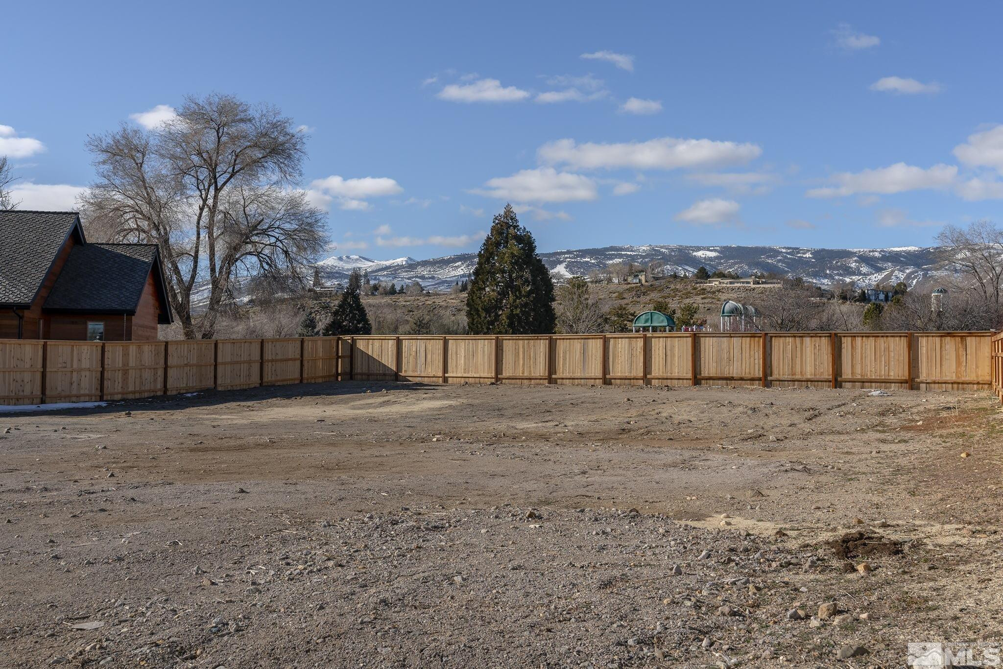 6161 Triple Crown, Unit 6 Reno, NV 89511 - Photo 2 of 6 a view of a yard with a slide