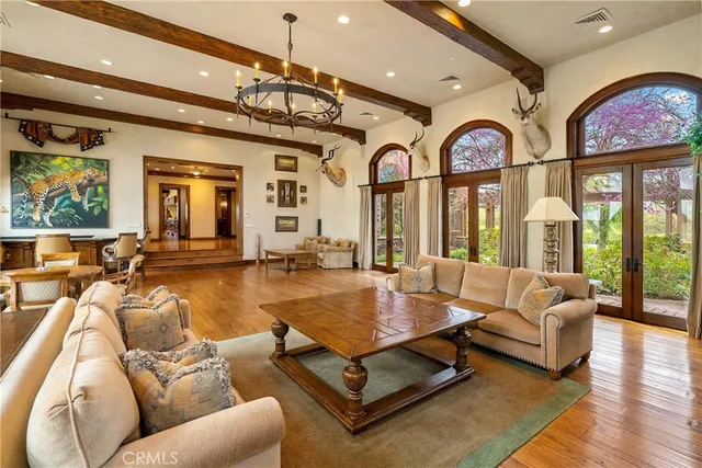 a lobby with furniture and floor to ceiling windows