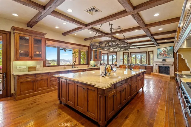 a living room with furniture pool table and a floor to ceiling window