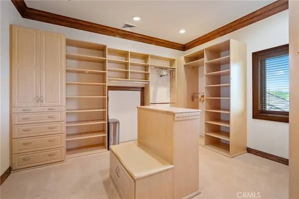 a view of hall way with furniture