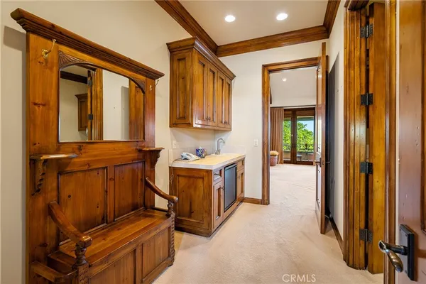 a view of a lake with a yard and a table and chairs