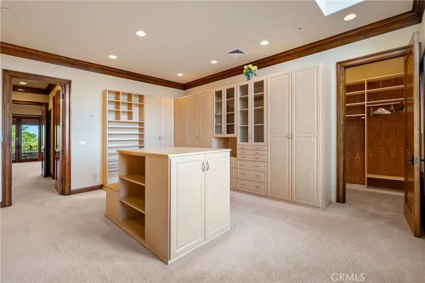 a view of a house with a big yard and sitting area