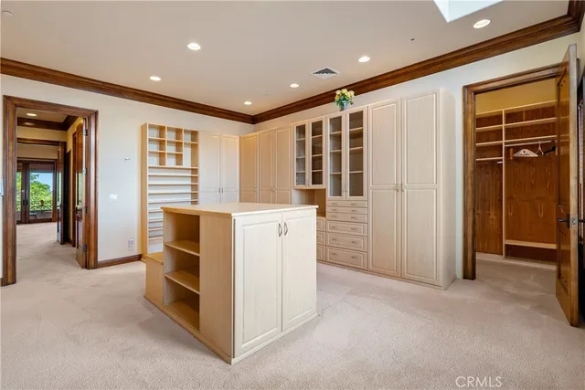 a view of a house with a big yard and sitting area