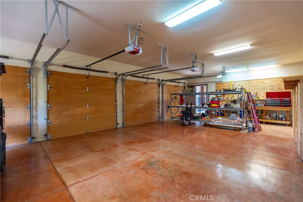 76525 Interlake Road Bradley, CA 93426 - Photo 44 of 75 a view of a garage with a bike and a garage