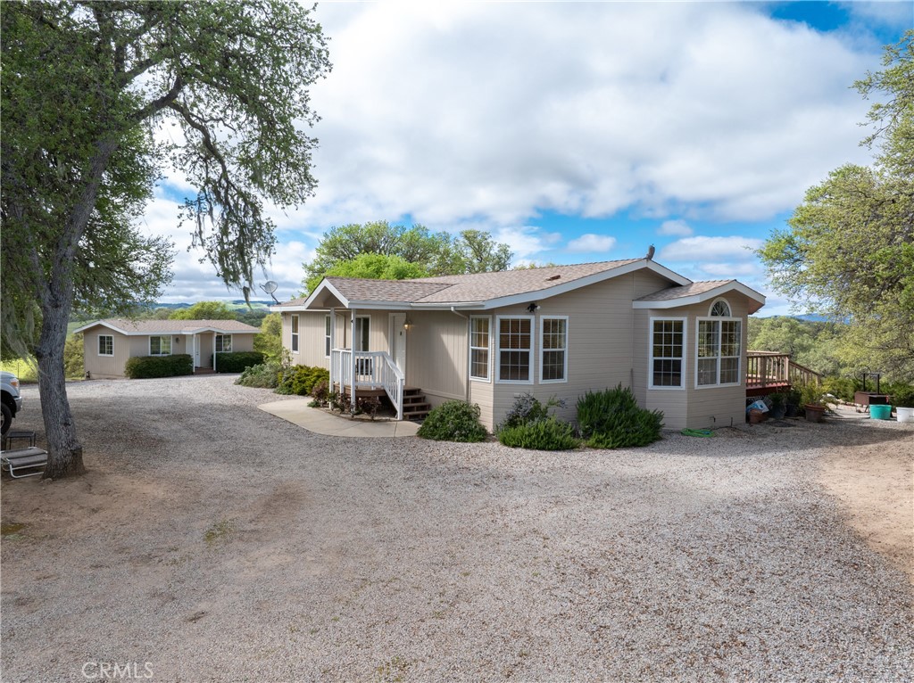 76525 Interlake Road Bradley, CA 93426 - Photo 49 of 75 a front view of a house with a garden and trees