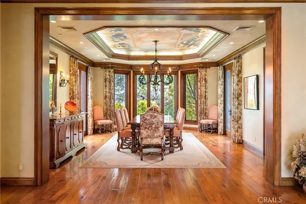 a living room with furniture a large window and a clock