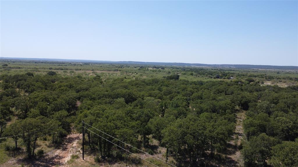 Lot 57 Paradise Oaks Ranch Graford, TX 76449 - Photo 5 of 14 an aerial view of a house with a yard