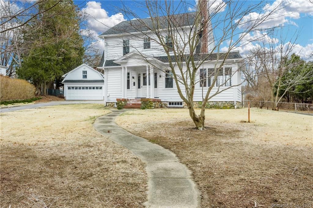 169 Harland Road Norwich, CT 06360 - Photo 1 of 1 a view of a white house with a yard covered with snow