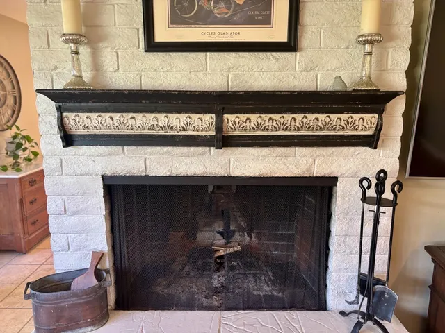 a view of a livingroom with wooden floor and a window