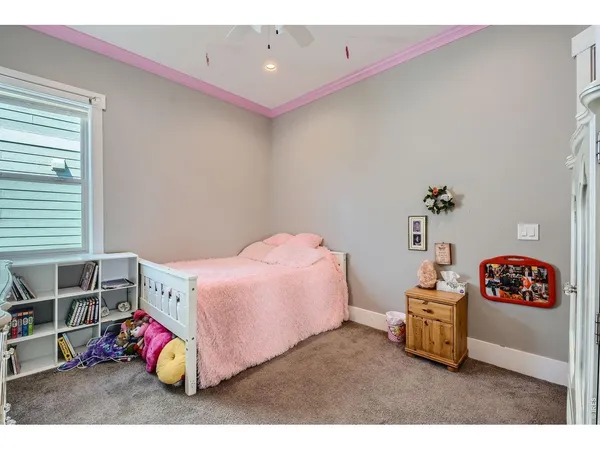 a bedroom with a bed and a couch