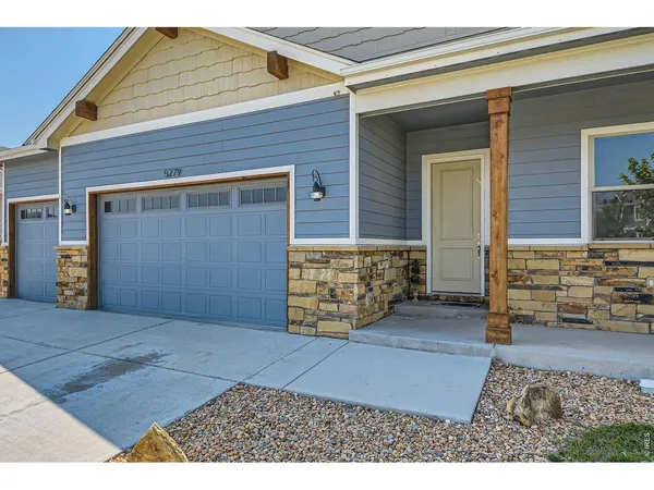 a view of front door of house with a couch