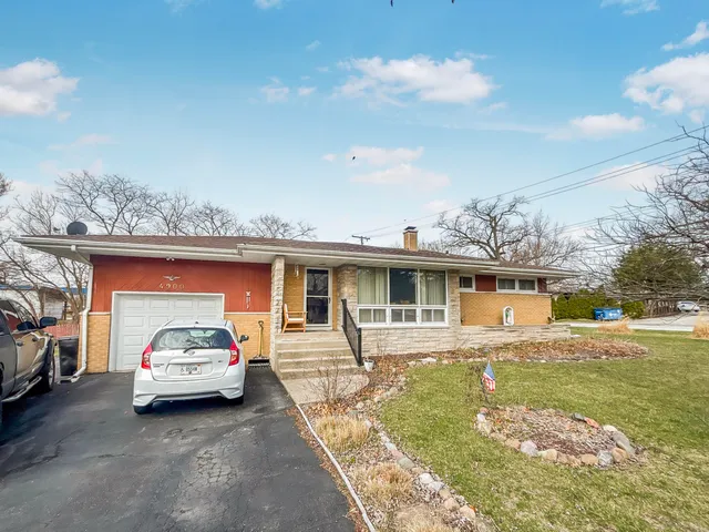 a car parked in front of a house