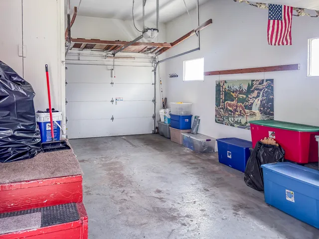 a view of a porch with a table and chairs