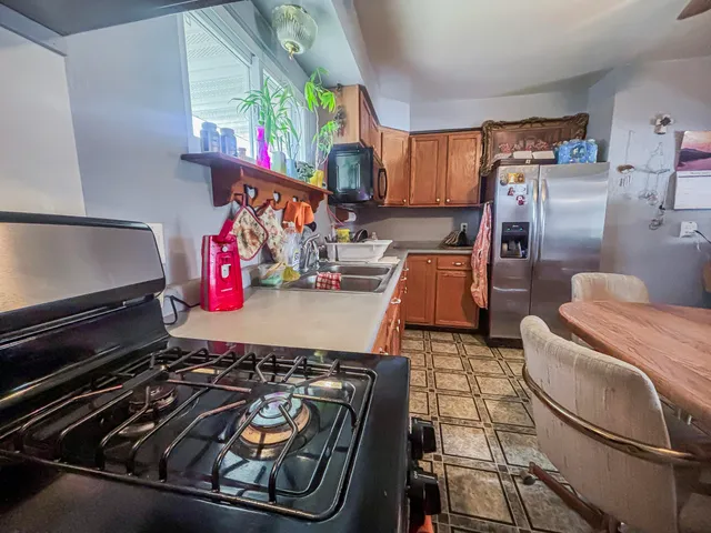 a view of room with cabinets and wooden floor