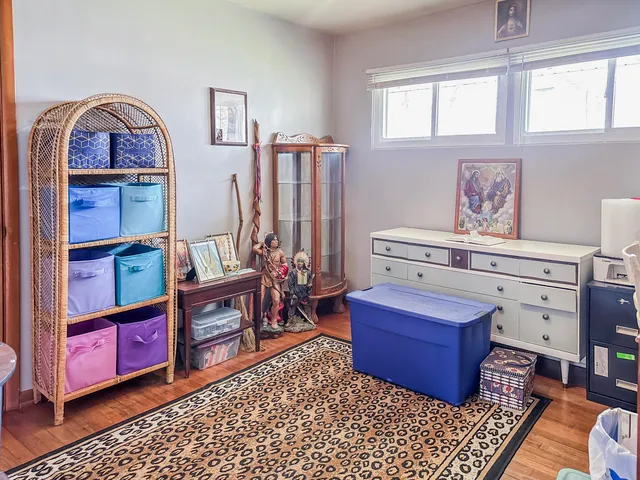 a bedroom with a bed and a fireplace