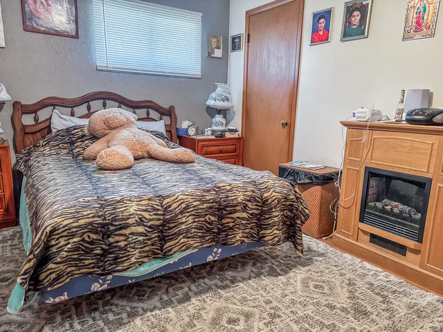 a bedroom with furniture and a baby crib